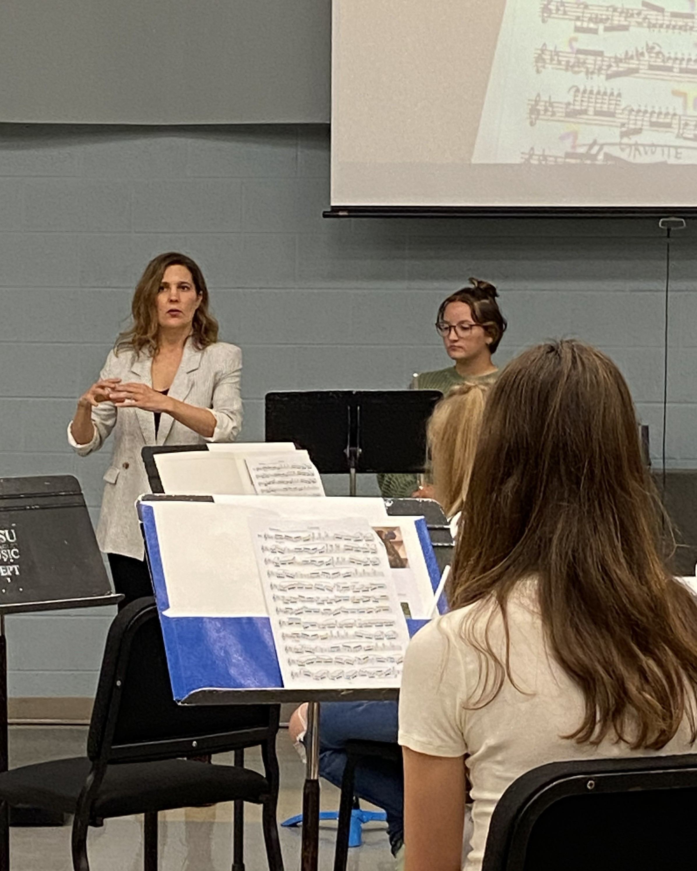 Abigail Walsh explaining a musical concept during a flute masterclass.